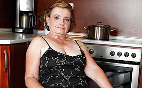 Naughty mature <b>lady</b> playing in the kitchen